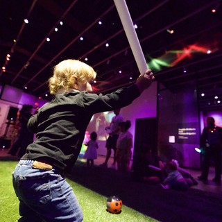 Young Child Playing Cricket at Baby Rave Event