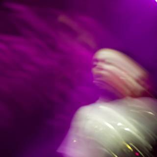 Blurred Spotlight on a Concertgoer
