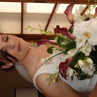 Bride with Bouquet Gazing Softly by Window