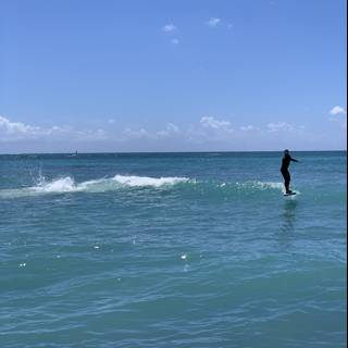 Surfing the Sea Waves at Waikiki Beach