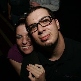Couple Poses Together at Late Night Event