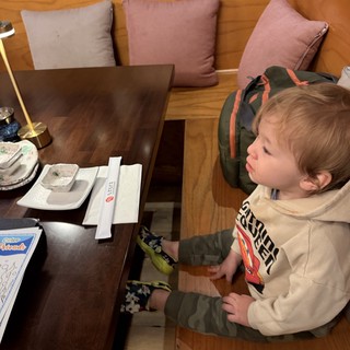 Young Child at Japanese Restaurant Table