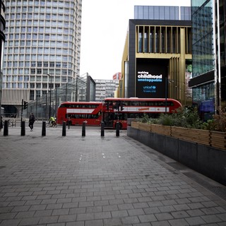 Modern London Plaza with Red Double-Decker Bus