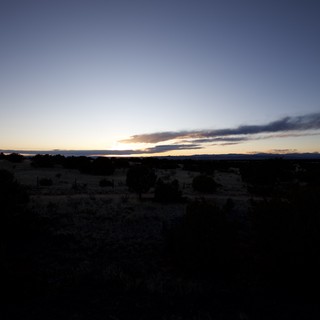 Desert Twilight Under Dramatic Cloud Formation