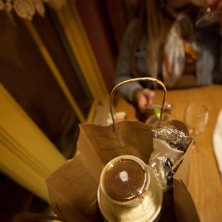 Takeout Dinner and Teapot on Restaurant Table