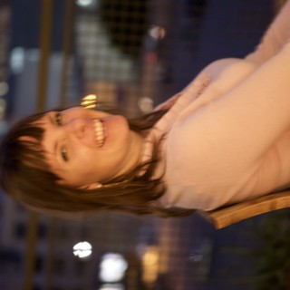 Joyful Woman Laughing at Night in the City