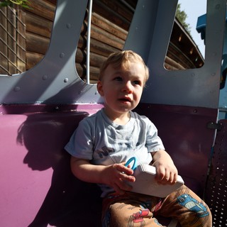 Toddler at Colorful Playground in Fantasyland