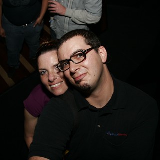 Couple Poses Together at Evening Social Event