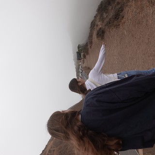 Two Women Walking on Foggy Coastal Trail