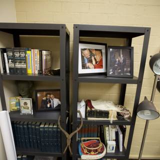 Shelf Decor with Tenzin Gyatso and Cornel West