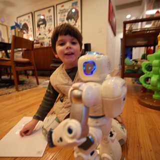 Child Playing with Robot Toy at Home
