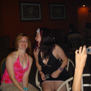 Friends Laughing Together at Late Night Party