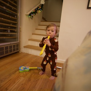Toddler Playing Yellow Recorder on Christmas Day