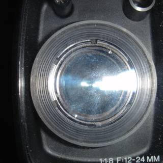 Illuminating the Zoom: A Close-Up of a Camera Lens with a Light