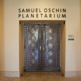 Samuel Oshin Planetarium's stylish wooden doorway