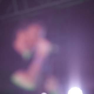 Blurred Lights and Energetic Performer