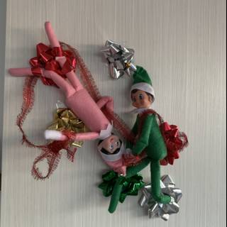 Elf on the Shelf playing with a hanging toy