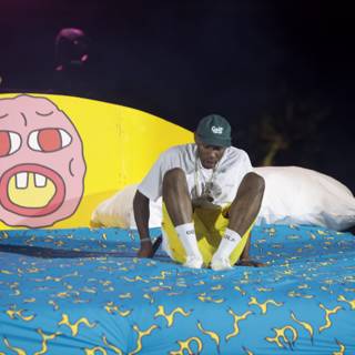 Tyler, The Creator lounges on cartoon bed