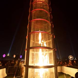 Tower Engulfed in Flames at Night