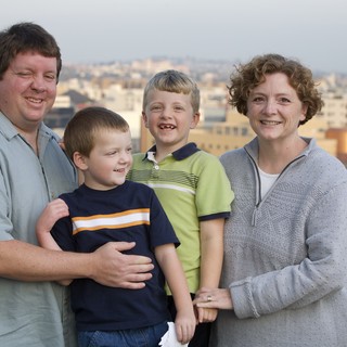 Family Portrait on Urban Rooftop at Dusk