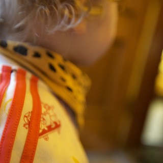 Child Playing Traditional Chinese Musical Instrument Close-Up