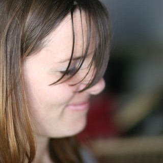 Windswept Hair Across a Gentle Smile