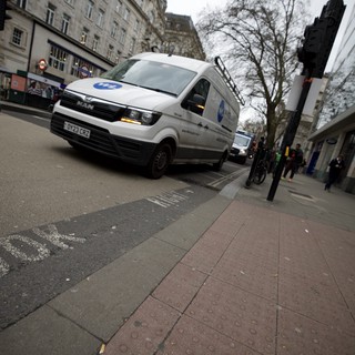 White Delivery Van on London Street Corner