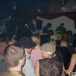 Partygoers Dancing the Night Away at a Nightclub