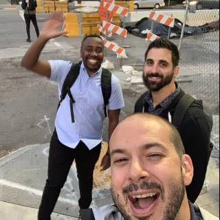 Three Men Taking a Selfie in Front of Construction Barriers in San Francisco