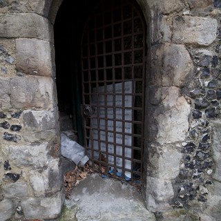 Ancient Stone Archway with Iron Portcullis Gate