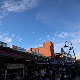 Bustling Fisherman's Wharf Seafood Market at Dusk
