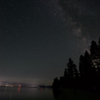 Milky Way Arches Over Tranquil Lake Tahoe Shoreline