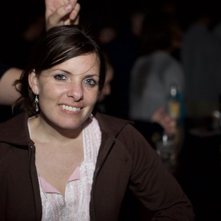 Woman Smiling at Nightclub Event in 2007