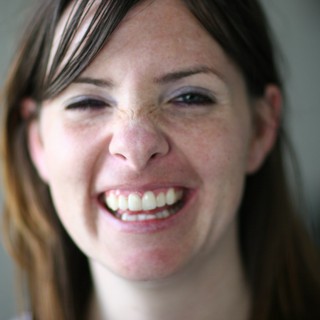 Joyful Woman with Freckles Laughing Candidly