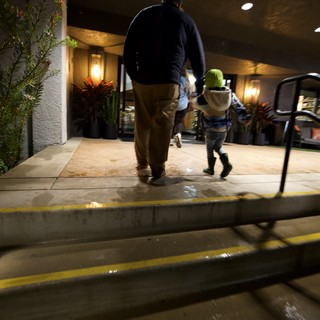 Father and Child Walking Home on Winter Evening