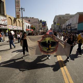 May Day Marchers Hold High the Flag