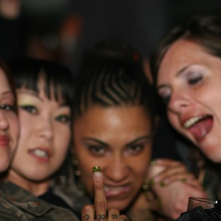 Four Friends Celebrating at a Nightclub Party