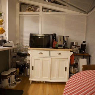 Cozy Kitchen Corner with Vintage White Cabinet