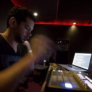 Marc Kinchen creating beats with his trusty laptop