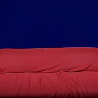Vibrant Red Couch in Blue Surroundings