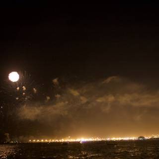 Fireworks Spectacle Over the Moonlit Bay
