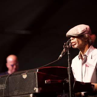 Man in Hat Playing Keyboard on Stage at 2010 Cochella Friday
