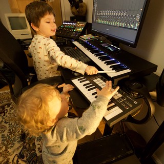 Young Children Making Music in Home Recording Studio