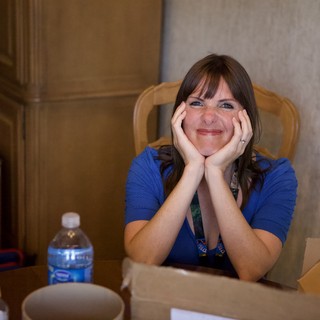 Cheerful Woman at DEF CON 18 Conference Table