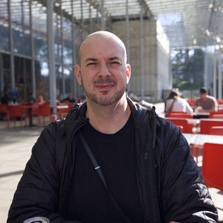 Portrait at Modern Public Space with Red Seating