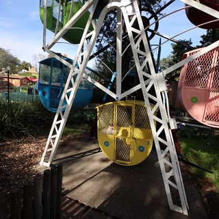 Vintage Ferris Wheel with Colorful Gondolas at Amusement Park