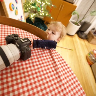 Toddler's Curious Encounter with Camera on Christmas Morning