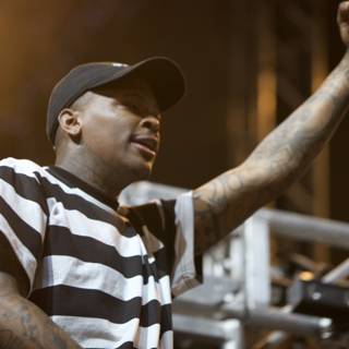 YG showing off his tattoos