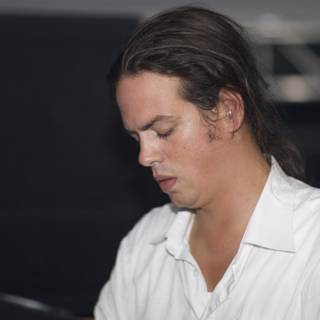 Long-Haired Man in a White Shirt