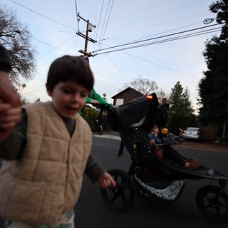 Children's Evening Bike Parade in Suburban Neighborhood
